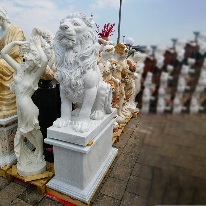 stone female lions in front of house