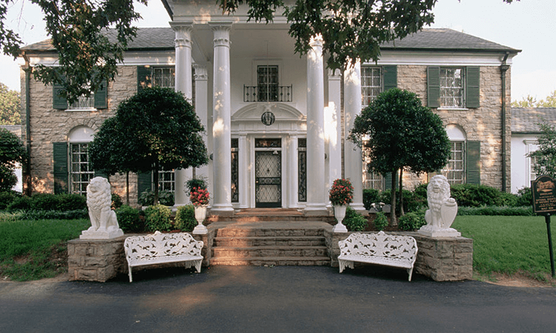 lion statues in front of a house