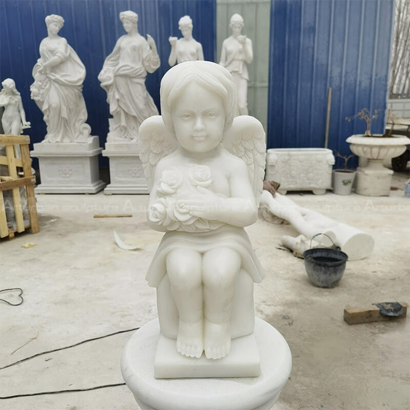 white marble cherub statue