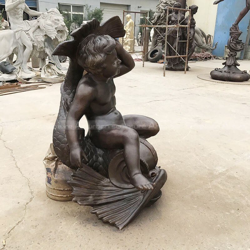 cherub with fish garden fountain