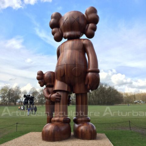 swizz beatz kaws statue