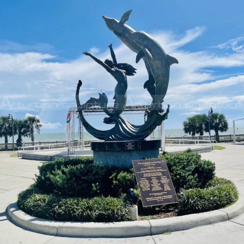 mermaid with dolphin sculpture