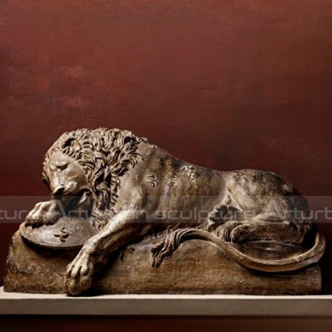 dying lion statue