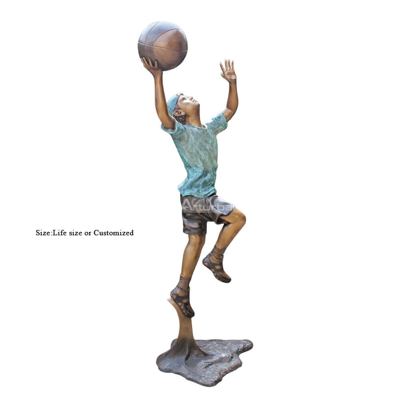 boy playing basketball statue