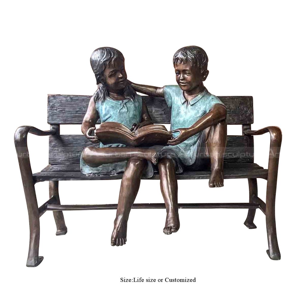 boy and girl reading book garden statue