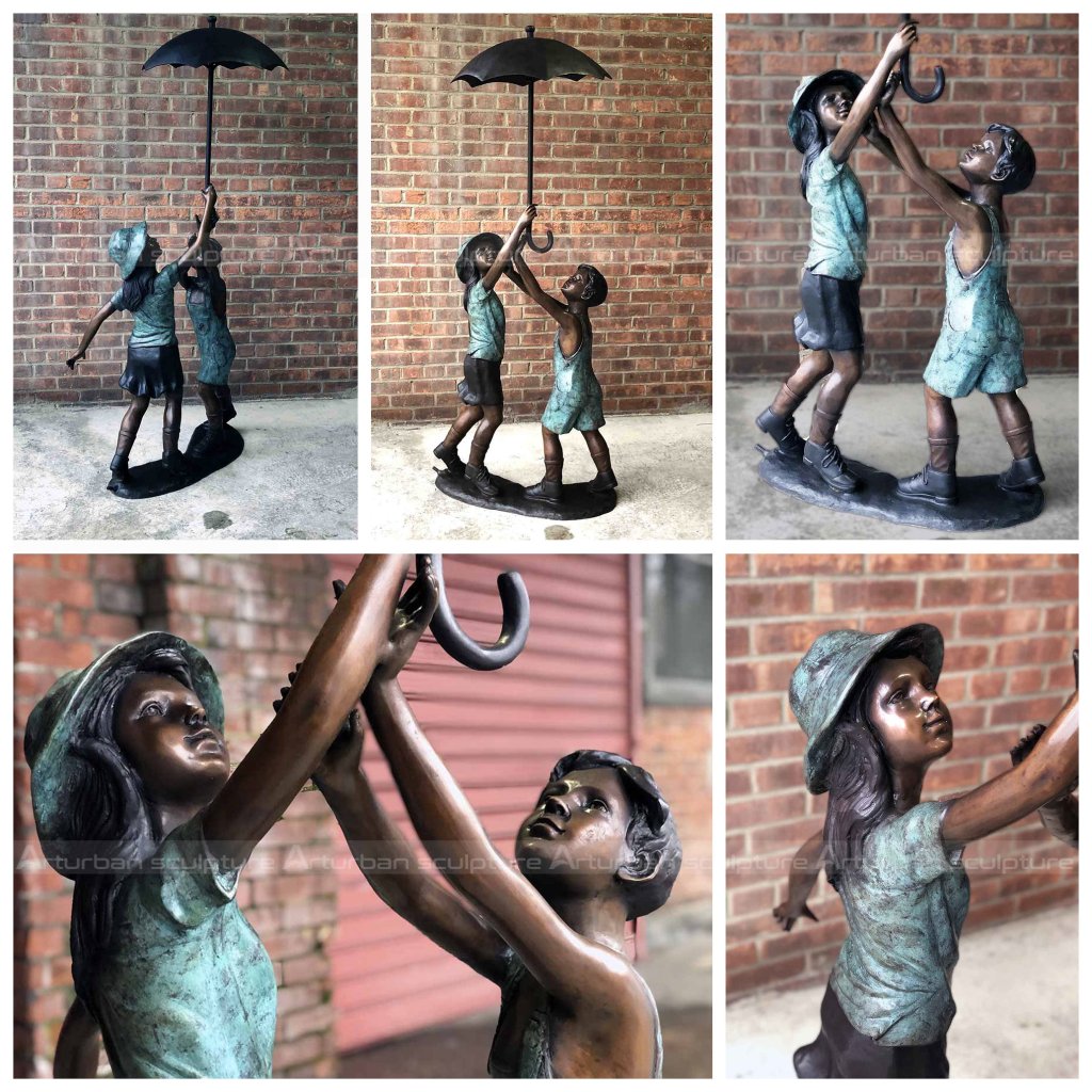 boy and girl under umbrella statue