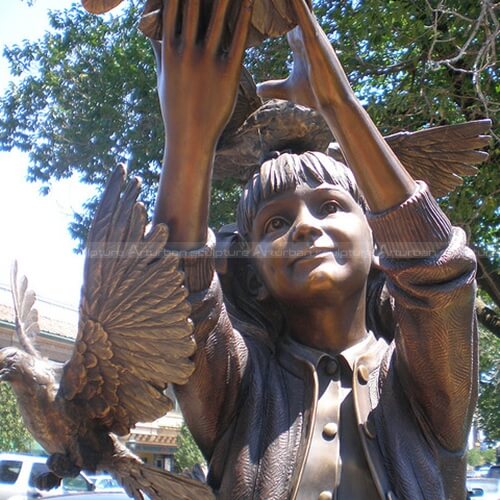 girl and pigeon sculpture