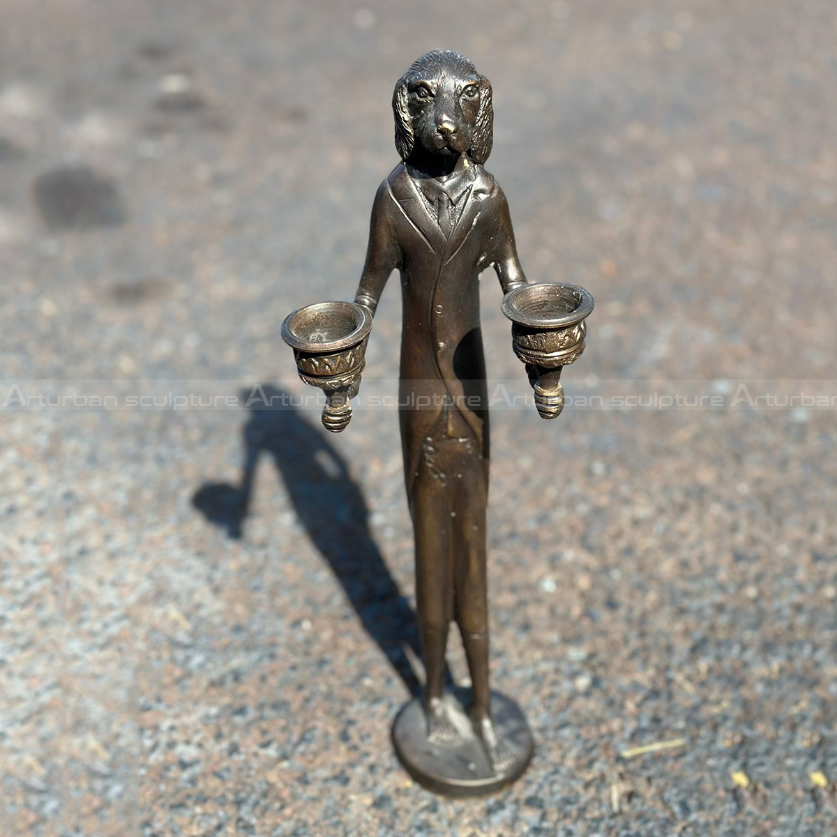 Bronze Dog Man Sculpture in Victorian style, featuring a dog-headed gentleman in a suit holding two ornate candle holders