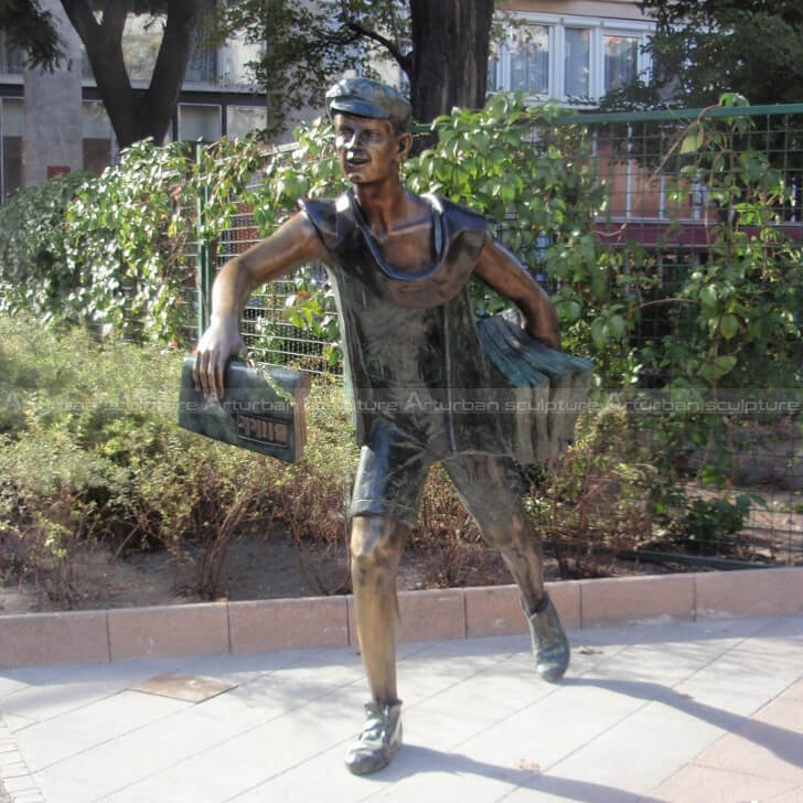 Newspaper boy statue