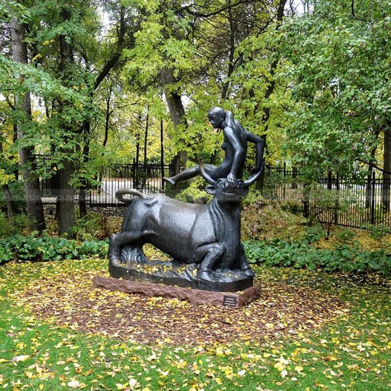 woman riding bull statue