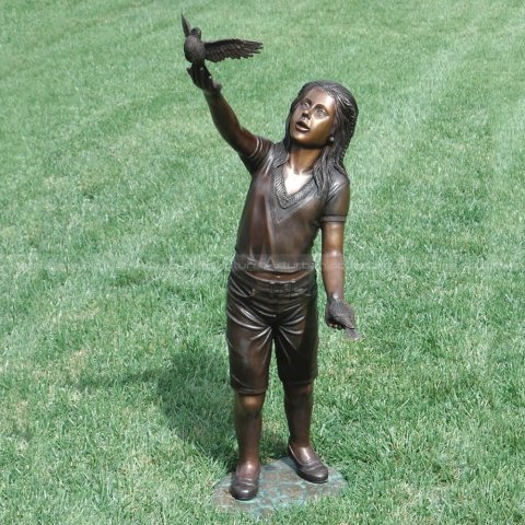 girl with bird sculpture