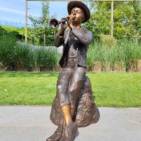 boy with flute statue