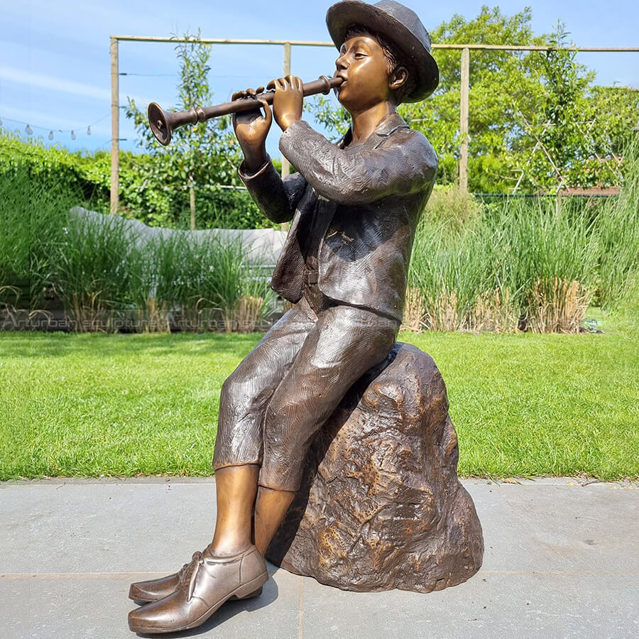 boy with flute statue