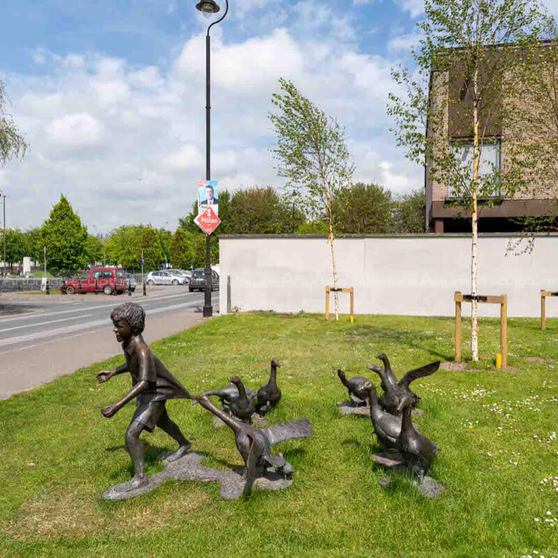 boy and geese sculpture