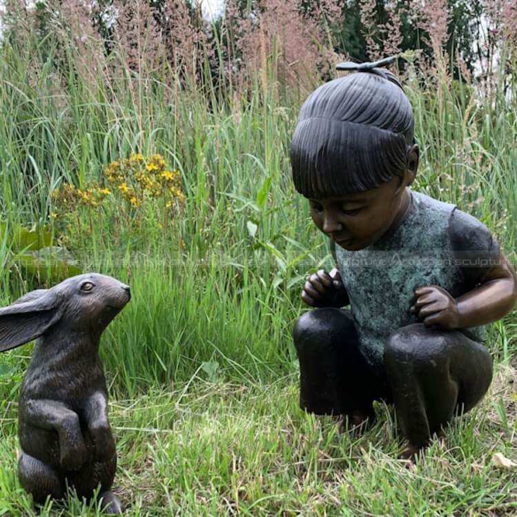 girl with rabbit statue