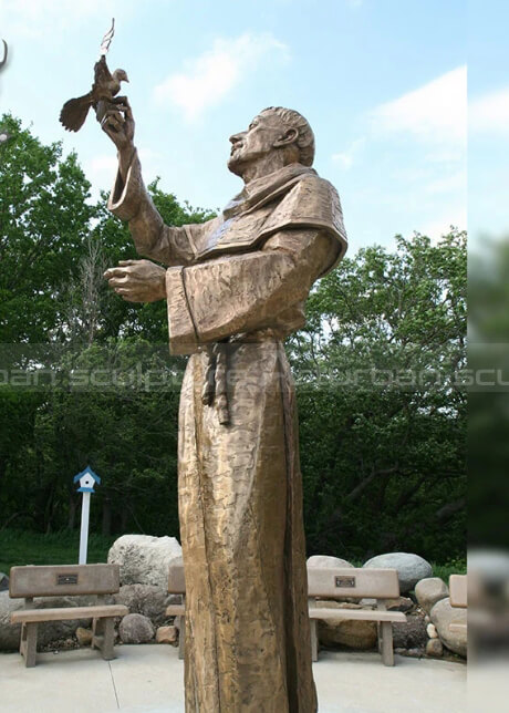 st francis statue with birds