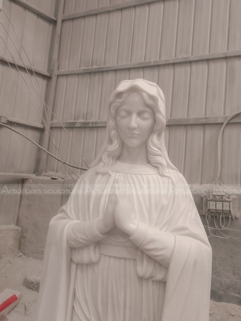 Marble virgin Mary statue is a sculpture with religious significance and artistic value. This sculpture is based on the theme of the Virgin Mary