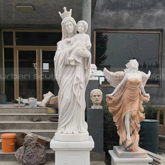 virgin mary holding jesus sculpture