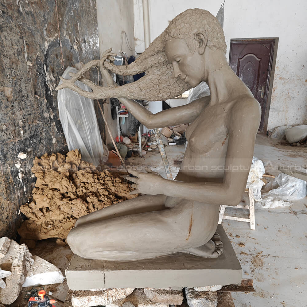 girl washing her hair sculpture