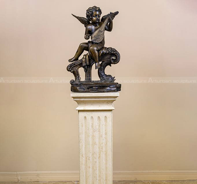 cherub playing guitar statue