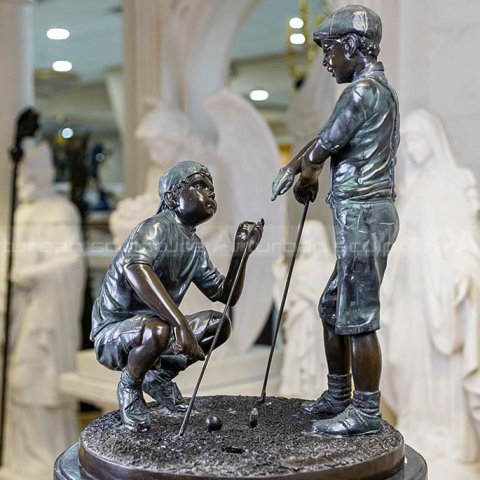 boy golfer statue