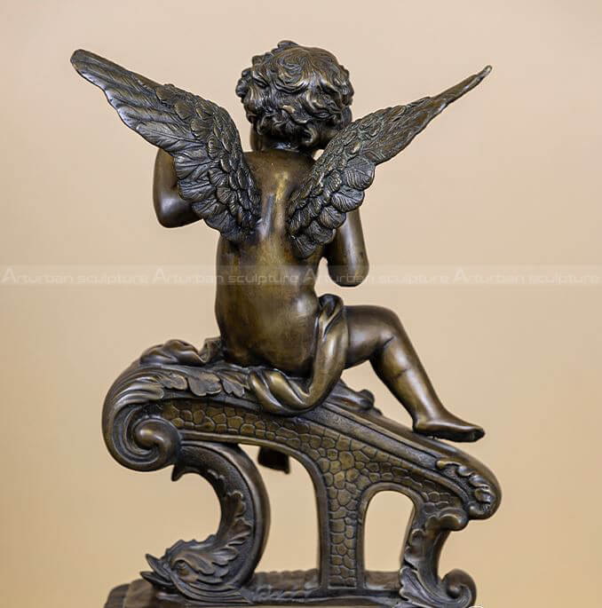 cherub playing guitar statue