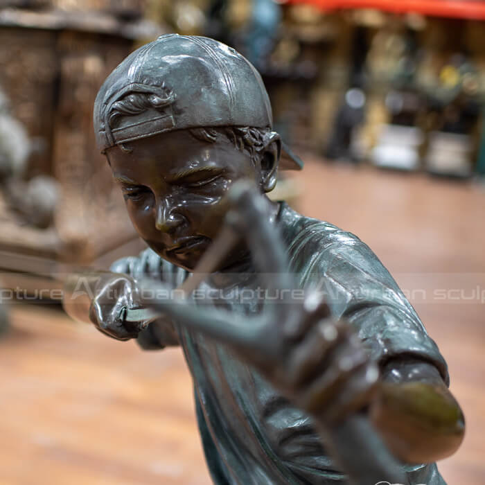 boy with slingshot statue