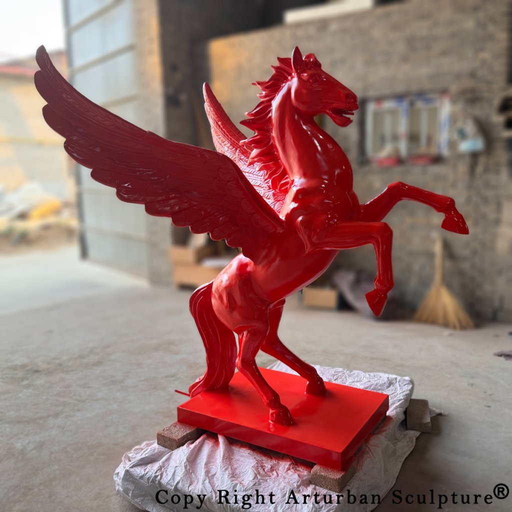 life size red pegasus animal sculpture