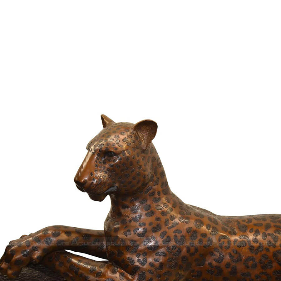 leopard on tree sculpture