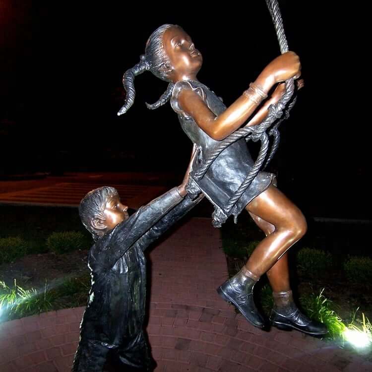 Boy and Girl on Swing Statue