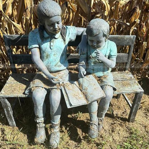 Statue of Kids Reading on Bench