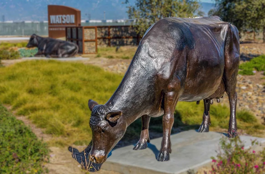 cow drinking statue