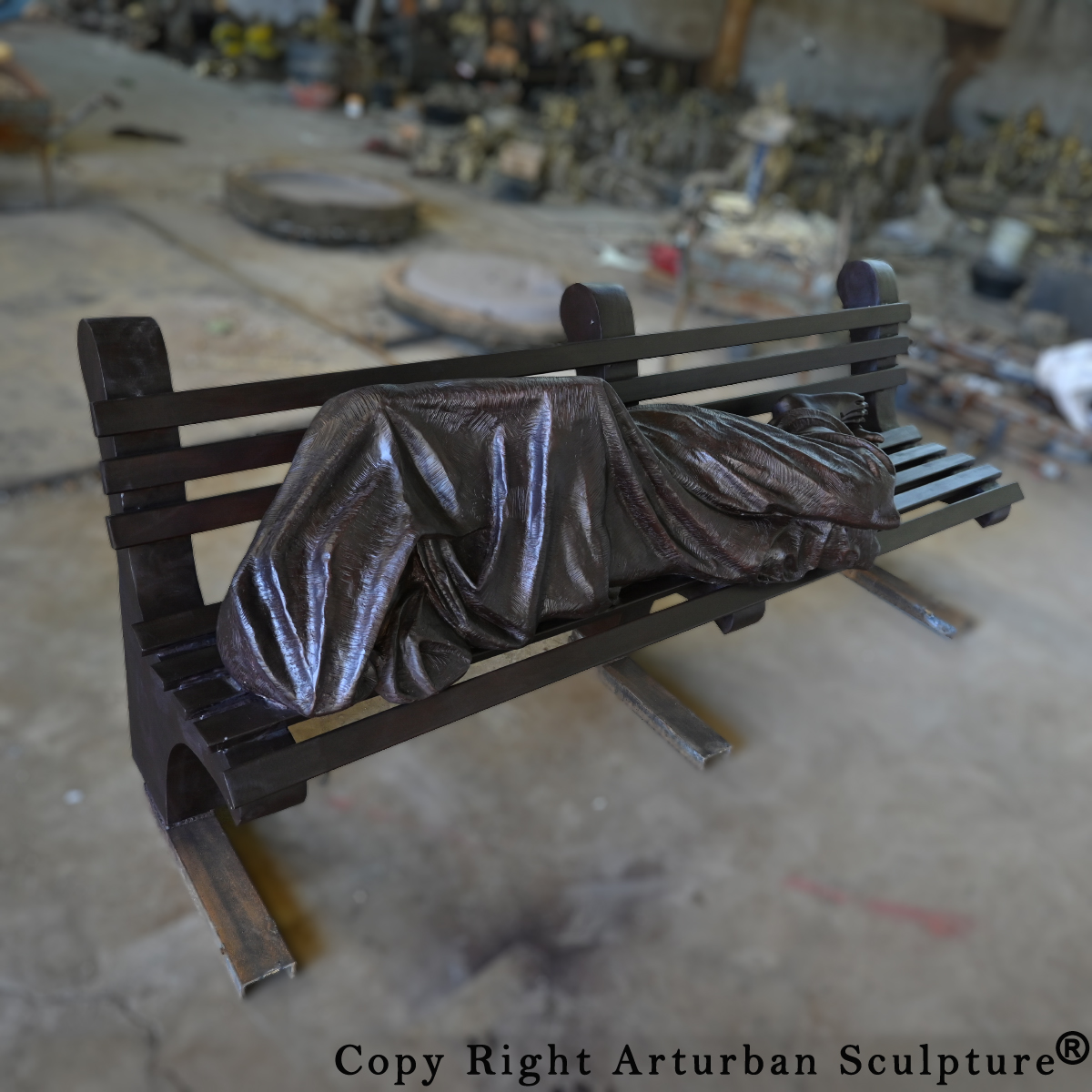 Statue of Jesus Sleeping on Bench