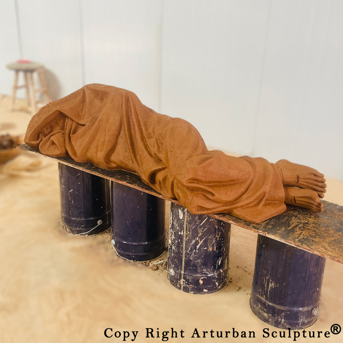 Statue of Jesus Sleeping on Bench