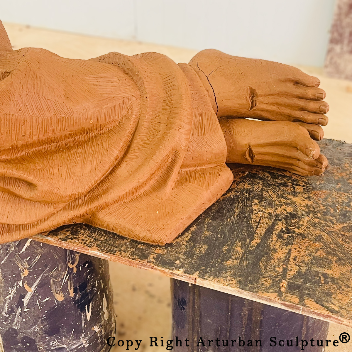 Statue of Jesus Sleeping on Bench