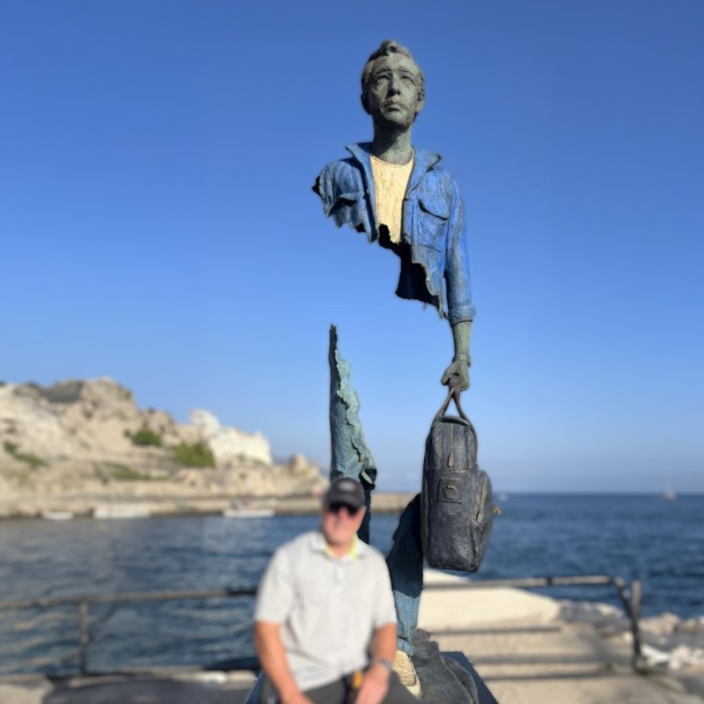 Man with Suitcase Sculpture