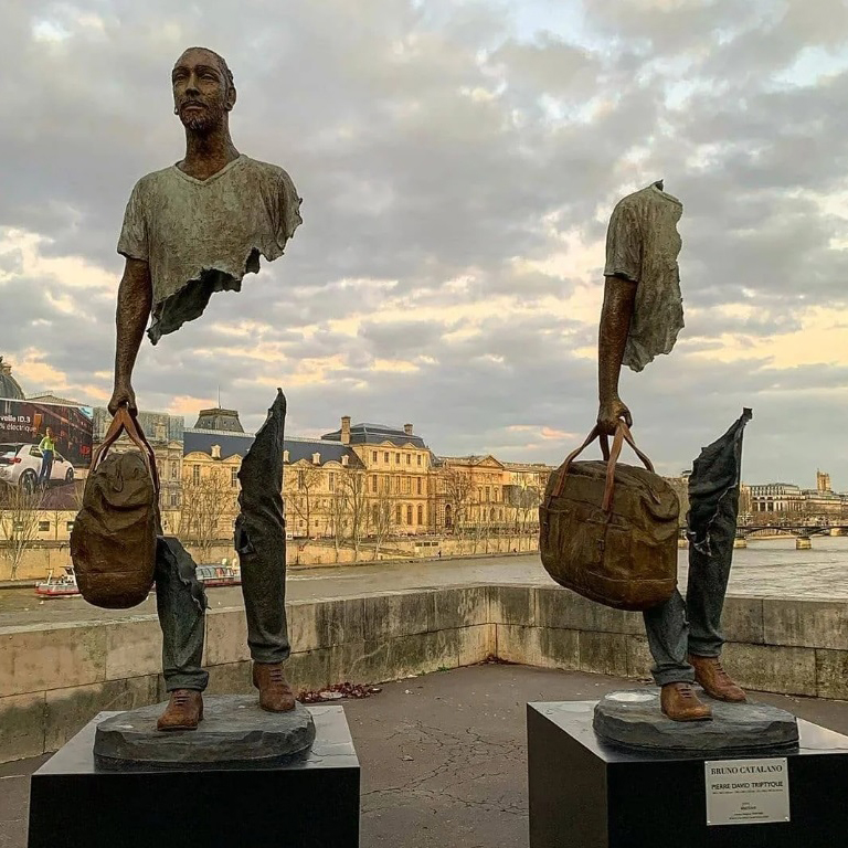 Man with Suitcase statue