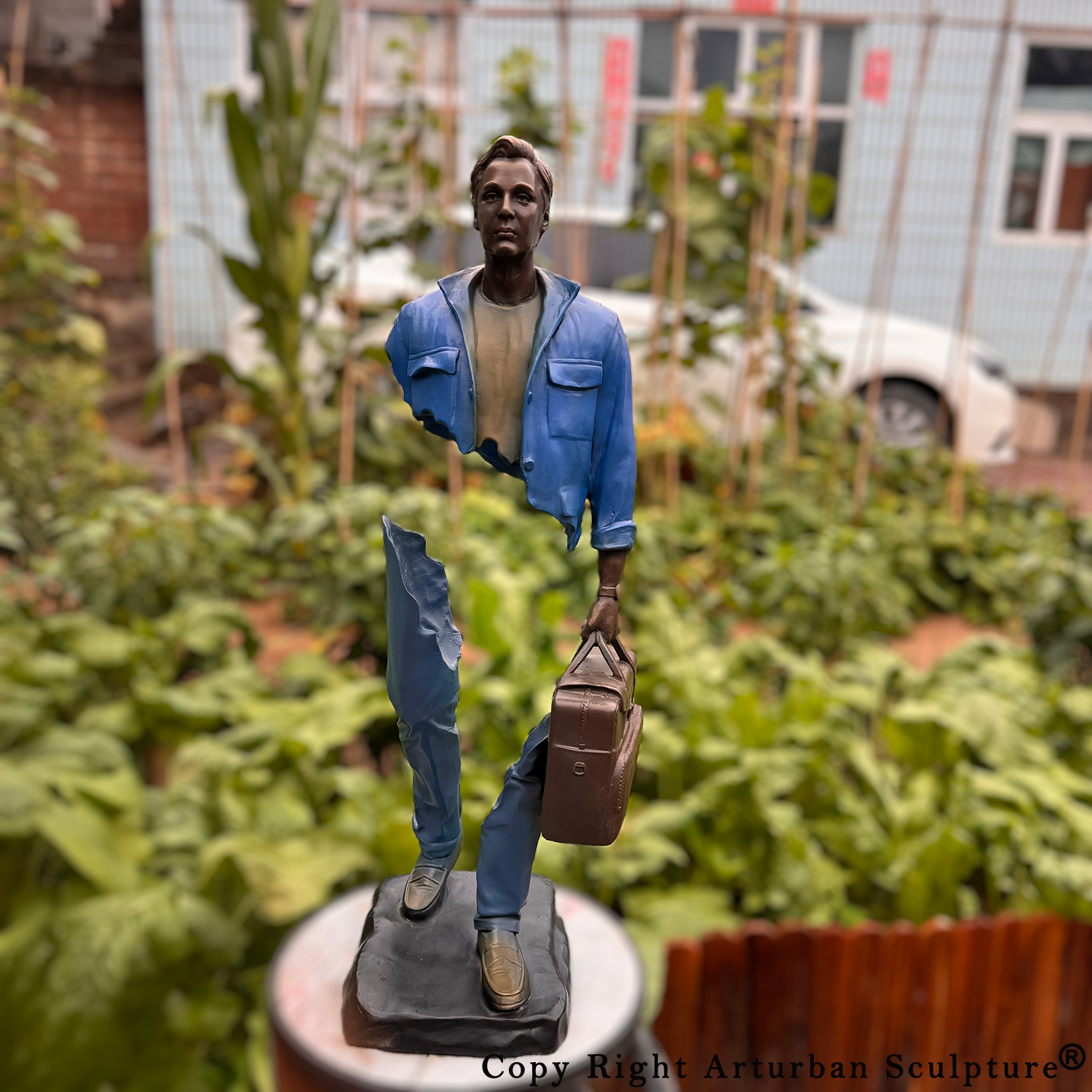 Man with Suitcase Sculpture