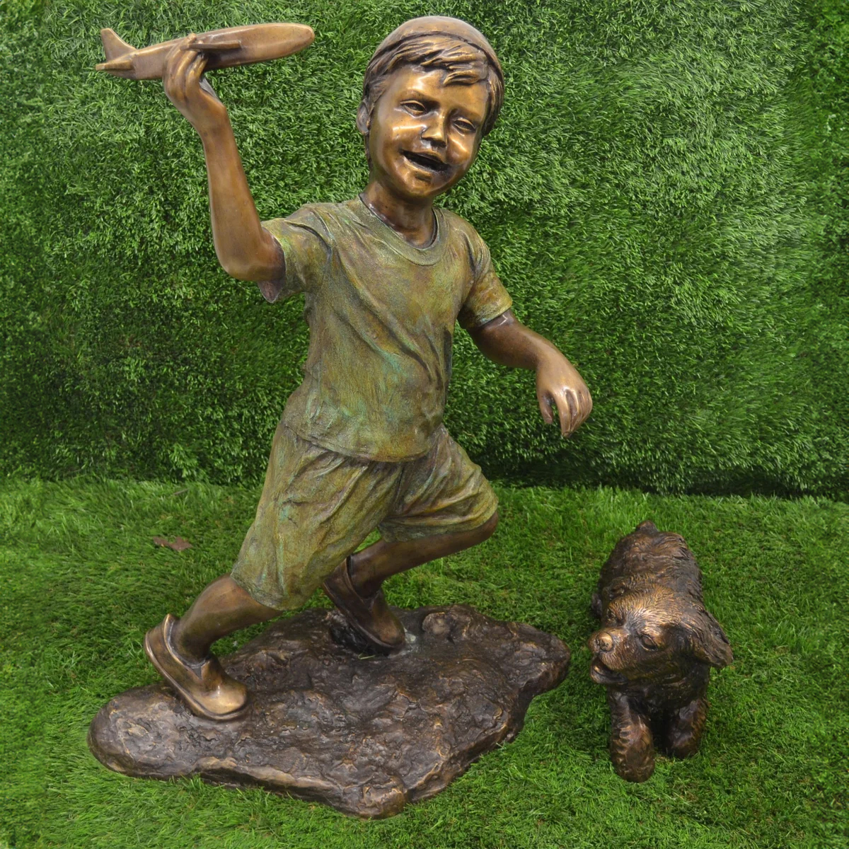 Boy Flying Plane Statue