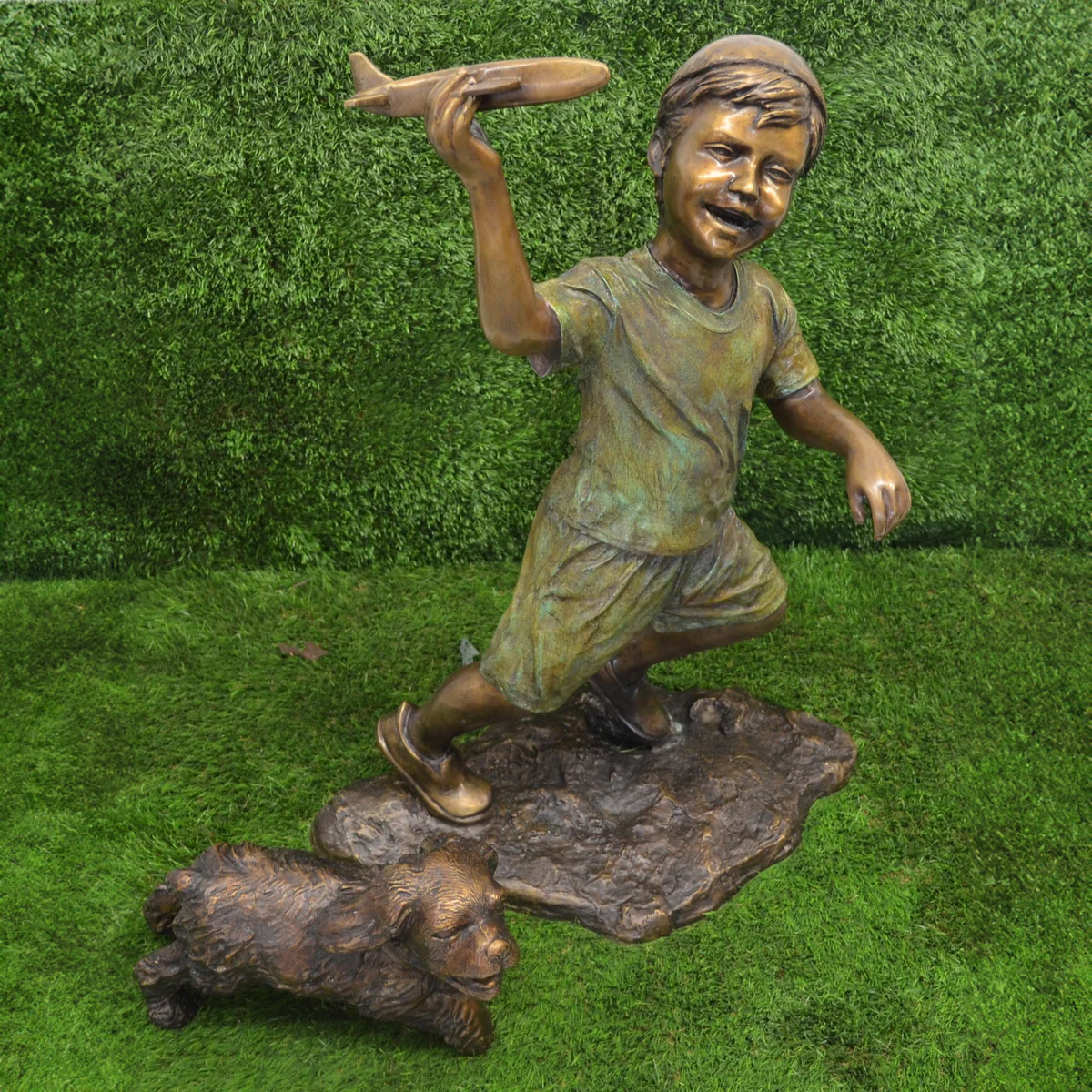 Boy Flying Plane Statue