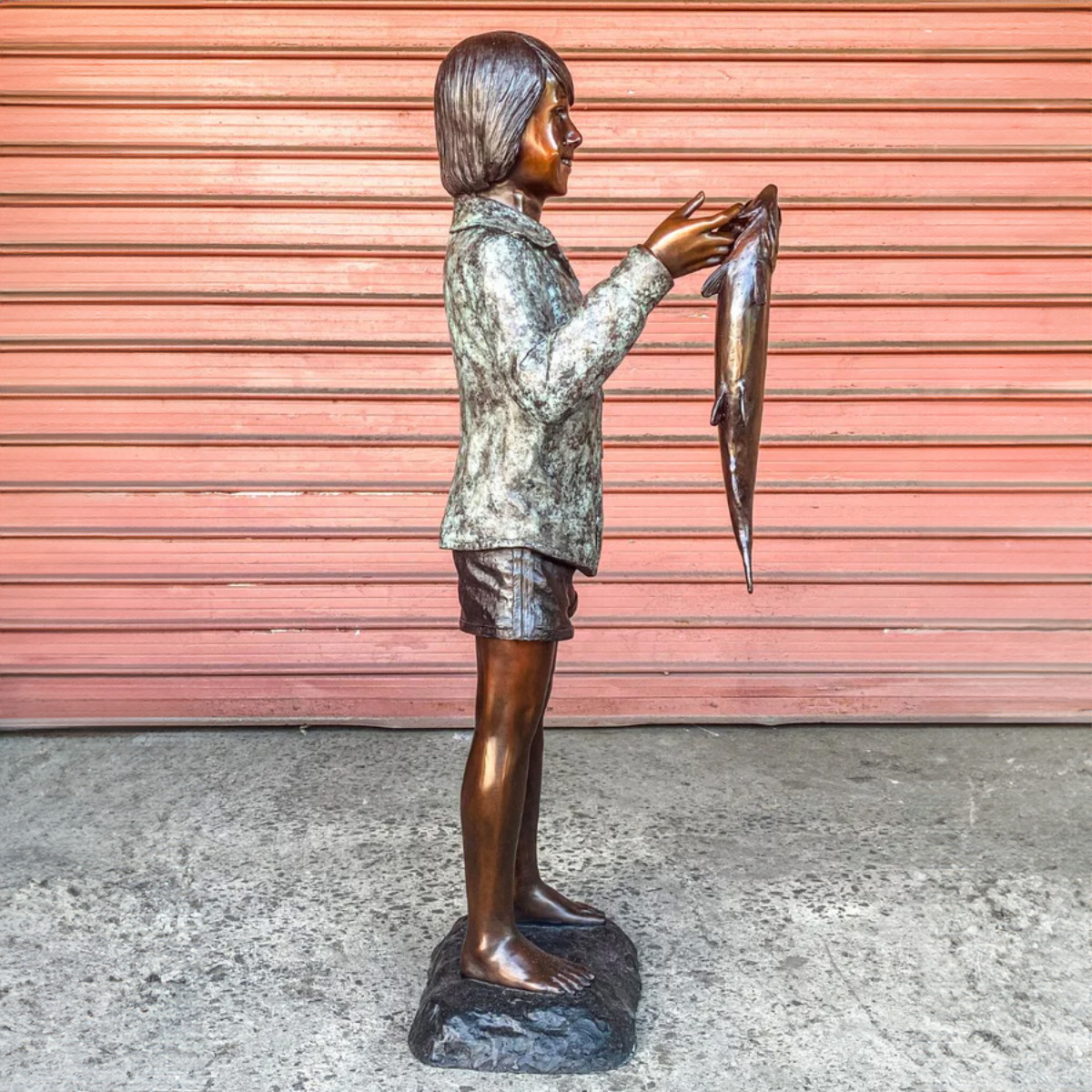 Boy with Fish Statue