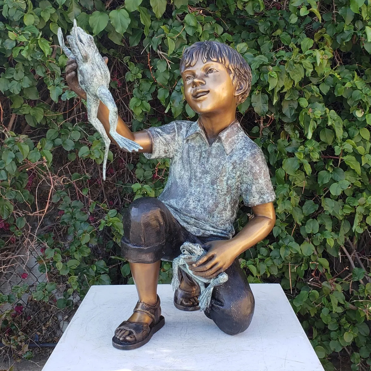 Boy Holding Frog Statue