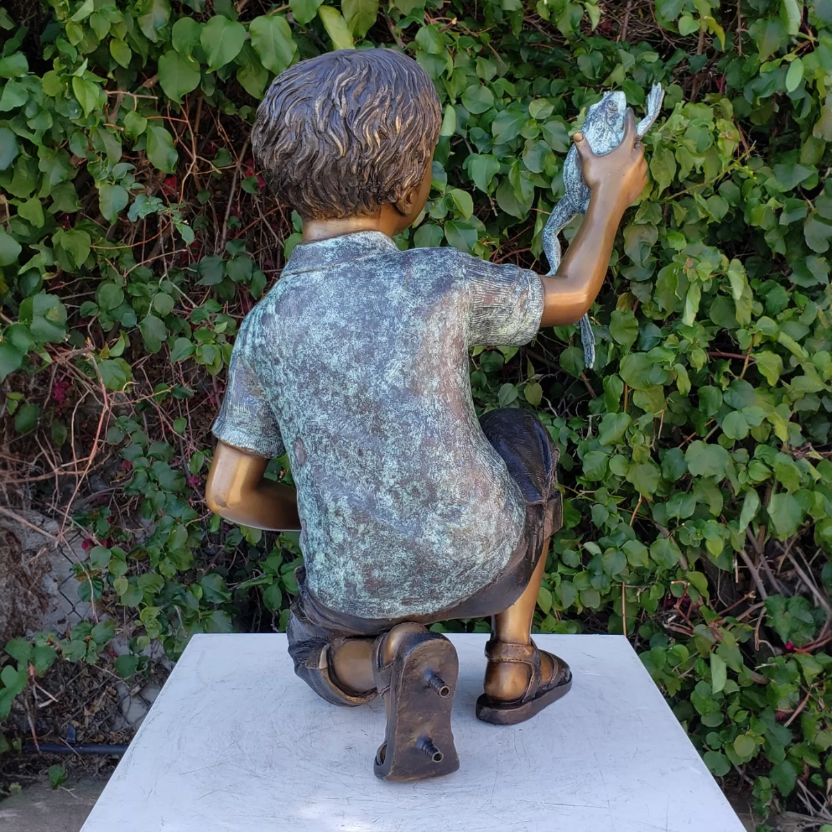 Boy Holding Frog Statue