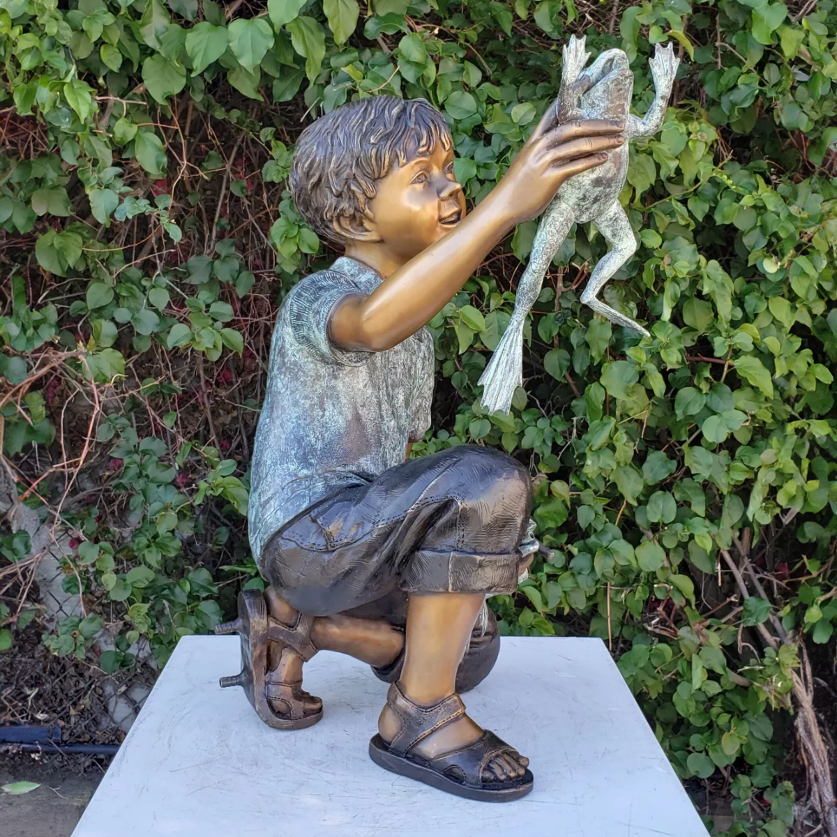 Boy Holding Frog Statue