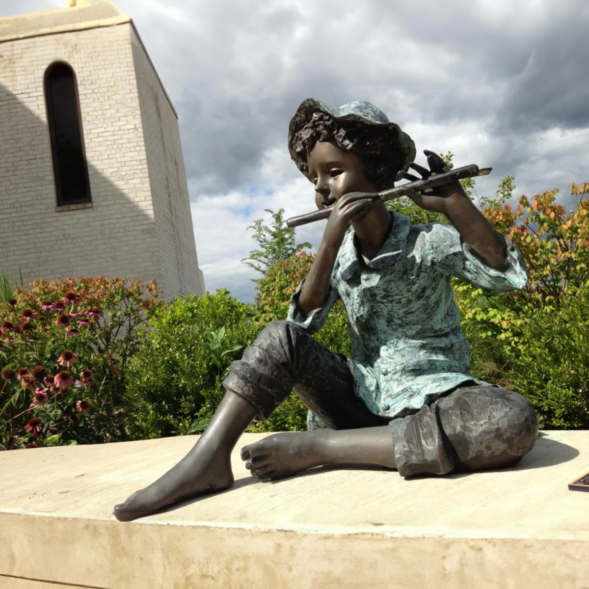 Boy Playing Flute Statue