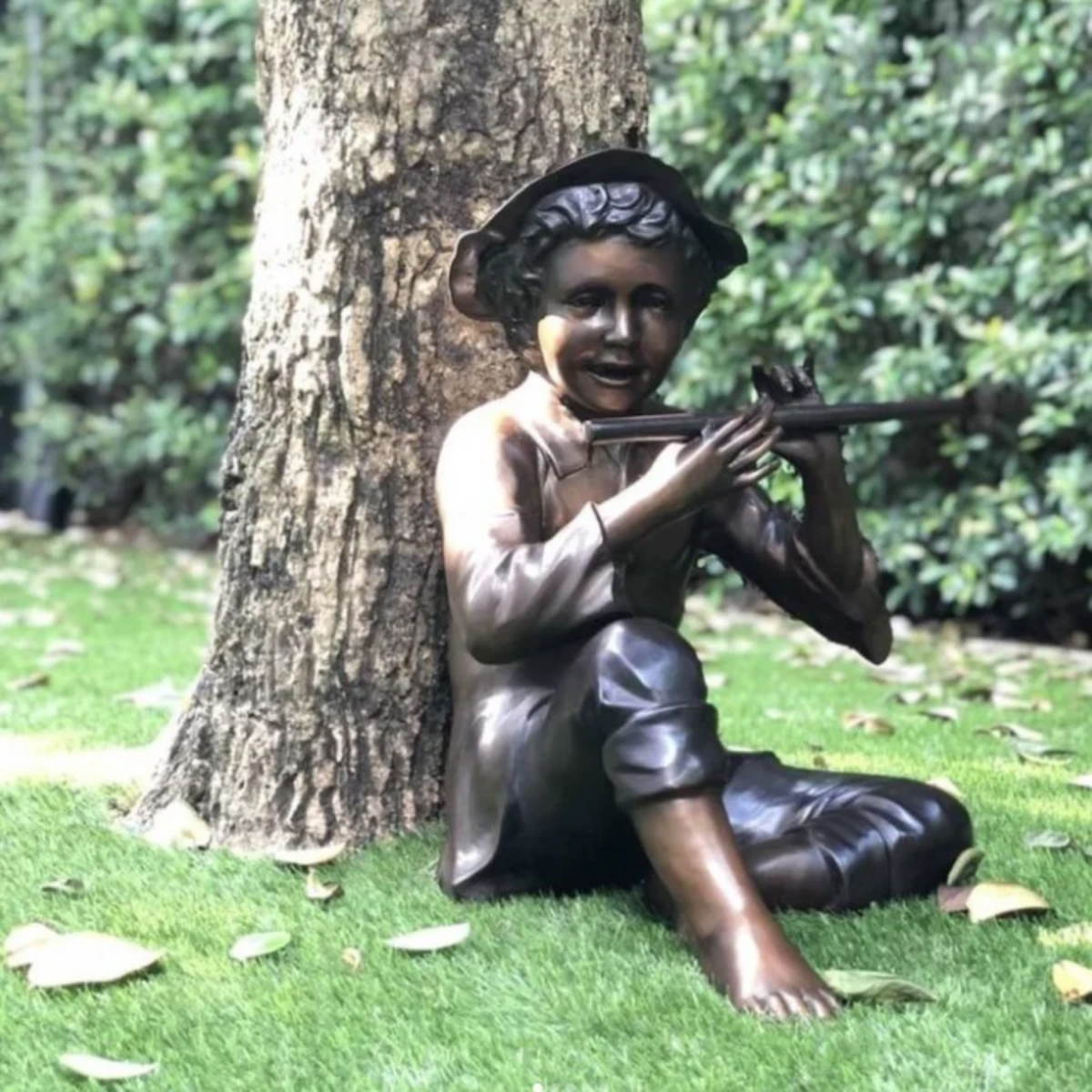 Boy Playing Flute Statue