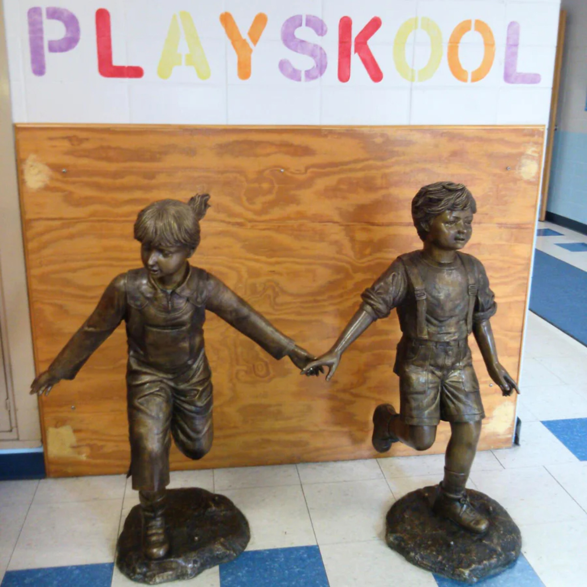 Boy and Girl Holding Hands Statue