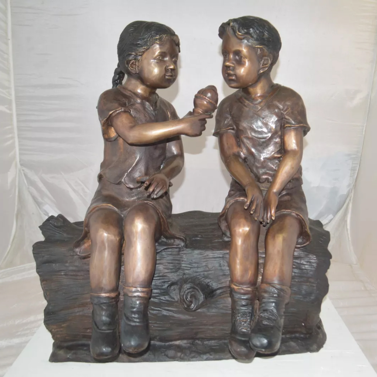 Boy and Girl Sitting Statue Outdoor