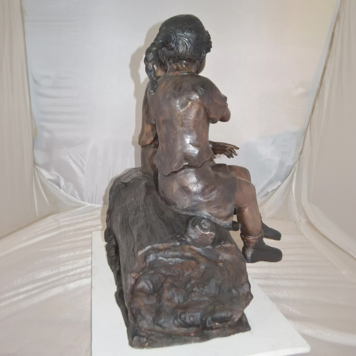 Boy and Girl Sitting Statue Outdoor