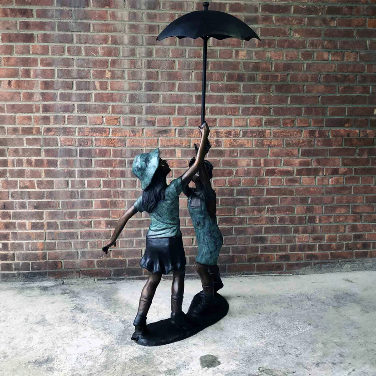 Bronze Boy and Girl Under Umbrella Fountain